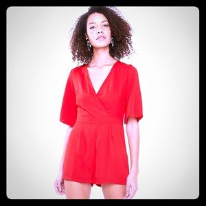 NWT MISGUIDED frilly open back playsuit.